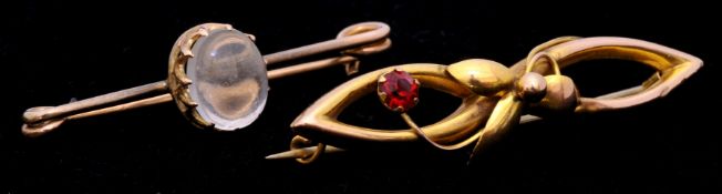 Two 9ct moonstone bar brooch and another ruby set brooch (2)