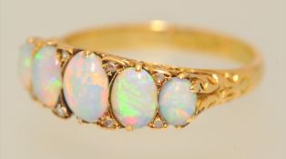 An antique five stone opal ring set in 18ct gold, size R