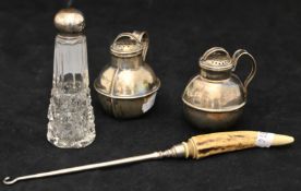 Three piece silver condiment set together with a button hook