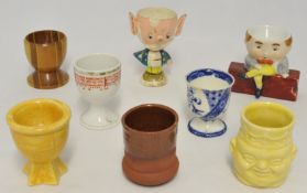 Large collection of various novelty egg cups, approx 220 in total