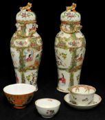Pair of Chinese `famille rose` baluster vases and covers, t/w two Chinese tea bowls
