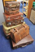 A collection of various leather and other suitcases and bags (9)