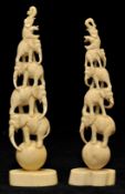 A pair of Eastern carved ivory groups of acrobatic elephants, 18cm