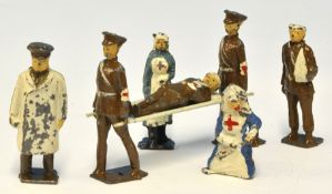 Unboxed set of lead figures comprising stretcher party, two nurses, doctor and two wounded soldiers