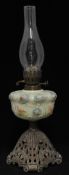A Victorian oil lamp with opaline glass reservoir and cast iron base, 57cm