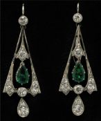 A fine pair of 18ct carat white gold emerald and diamond drop earrings of Art Deco design, emerald