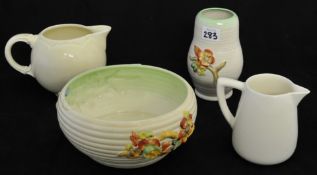 Clarice Cliff Autumn Leaf design fruit bowl and vase and two other undecorated Clarice Cliff jugs
