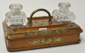 A Victorian mahogany desk stand with glass inkwell and brass mounts