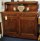 A mahogany Chiffonier with raised back, fitted with two drawers and two cupboard doors, 132cm wide,
