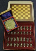 A modern Tudor Mint chess set, boxed together with a green marble solitaire set