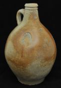 An antique salt glazed stoneware bellarmine jug, having moulded rim, various impressed marks 37cm