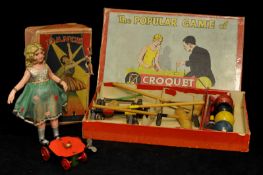 A Japanese clockwork Dancing figure, a Glevum table top Croquet set, both boxed (2)