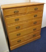 An Edwardian  light wood chest of drawers fitted with two short and four long drawers 129cm wide,