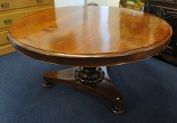 A Victorian mahogany circular dining table on pedestal base with tip up top, 112cm diameter