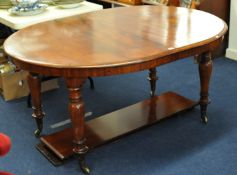A Victorian mahogany extending dining table with two extension leaves, on turned legs, 209cm long