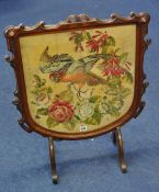 A Victorian carved and mahogany framed fire screen with tapestry bird picture, 70cm high x 57cm