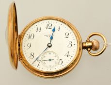 A 9ct gold Waltham half hunter pocket watch the dial with arabic numeral and sub second dial,