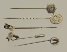 Five silver stick pins including ballet shoes and pearl