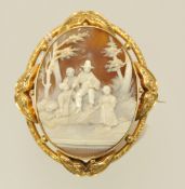 A fine Victorian shell cameo brooch in yellow metal, carved to depict a rural fishing scene, 8cm x