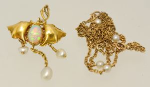 A fine antique gold pendant in the form of a Bat set with opals and pearls on fine chain