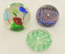 Three patterned paperweights, unmarked