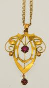 An Edwardian 9ct gold pendant and fine chain