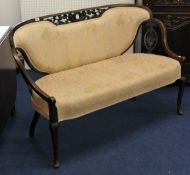 An early 20th century Settee with carved and stained wood frame , 137cm long