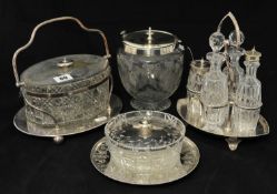 Four bottle cruet set with silver-plated stand together with three glass and silver-plated