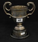 A silver twin handled trophy `Bartlett Memorial Trophy` approximately 240g with stand