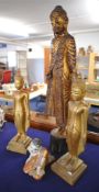 Group of four carved wood Burmese figures in gilt and paint decoration including Buddha, 107cm tall