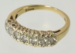 A seven stone diamond ring set in 18ct gold, size L