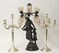 A pair of metal five light candelabra together with a reproduction French bronze effect figure table