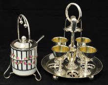 Four setting silver plated egg cruet together with jam pot on plated stand