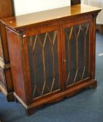 A free standing reproduction mahogany effect bookcase, 102cm wide