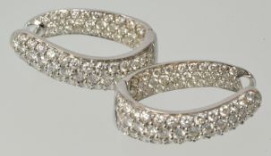 A fine pair of diamond set hinged hoop earrings, each pave set to front and inside with a total of
