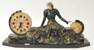 An Art Deco clock group in marble with painted metal sculpture, 63cm wide (a/f)