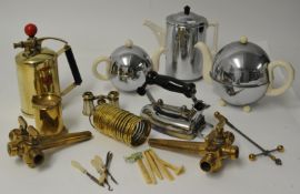 A collection of various metalwares and objects including keg taps, trivet iron, Art Deco chrome
