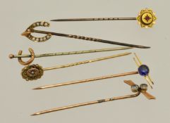 Six 9ct gold stick pins including ruby, pearl, sapphire