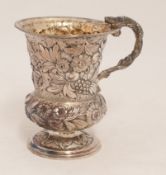 George III silver and gilt christening mug with embossed flower decoration and `Lizard` handle,