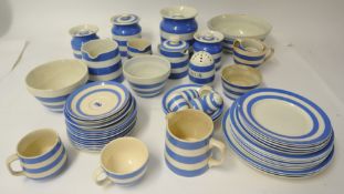 A collection of various Cornish Ware including jars and plates (with damage)