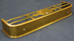 An early 20th century brass fire place fender, 120cm