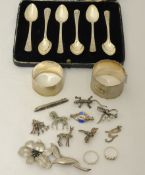 Two silver napkin rings, set 6 silver tea spoons (cased), also some silver jewellery