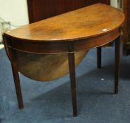 Georgian mahogany circular drop flap table on square tapered legs