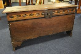 An oak coffer with lozenge and chip carving and iron lock 102cm wide, 54cm high,