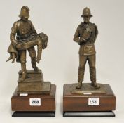 Two modern sculptures of firemen by Ray Brown on wood plinths, 32cm high