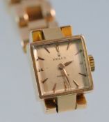 A Ladies 18ct gold Rolex wrist watch, the dial of square form, the bracelet stamped `Rolex`, no