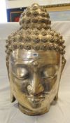 A large metal Buddha Head, 91cm high