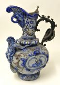 A large 19th century German stoneware heavily ornate jug (restored) 52 cm high