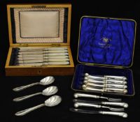 A 12 piece set of forks and knives with scrolling pistol grip silver handles in fitted case also two