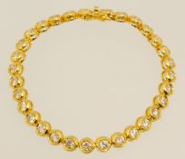 A fine 18 carat gold bracelet set with approx 31 round cut diamonds, 19cm